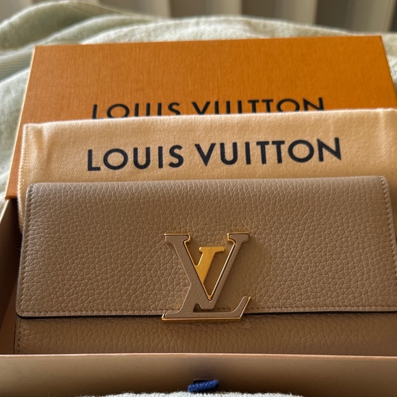 Louis Vuitton Handbags - NWOT Louis Vuitton Beige Leather Wallet with Gold Logo